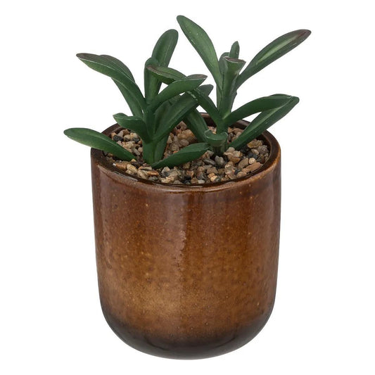 Plantă artificială într-un ghiveci de ceramică