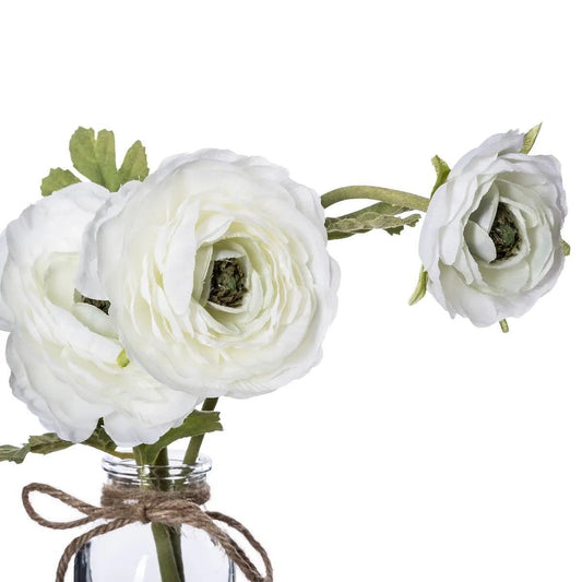 Floare artificială de camelie într-o vază de sticlă